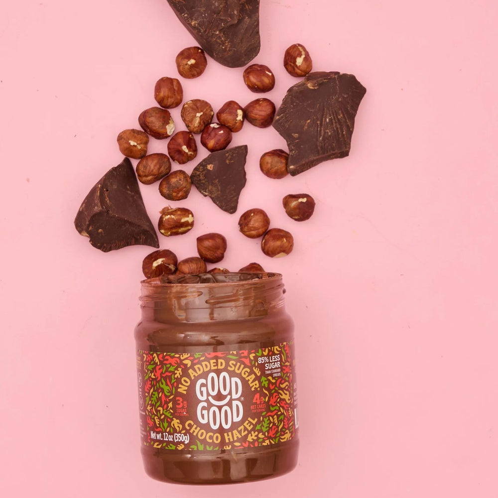 Good Good Choco Hazel Spread ingredients scene features hazelnuts and cocoa