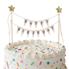 Gosknor Happy Birthday flag banner on cake adds festive charm.