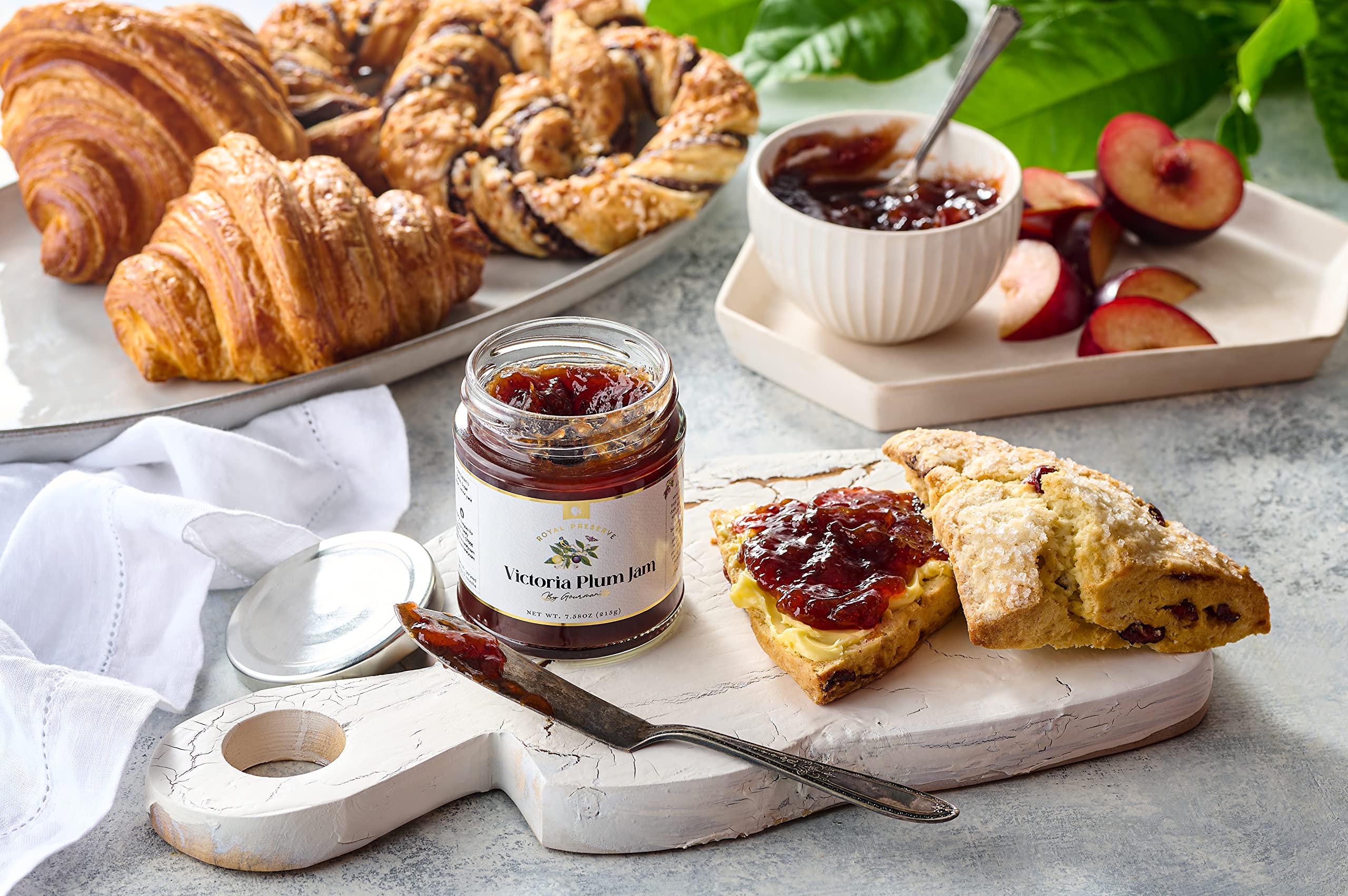 Bright kitchen scene with Gourmanity Victoria Plum Jam bottle and toast.
