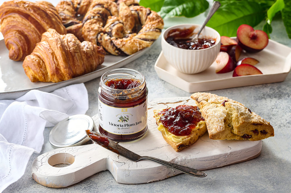 Bright kitchen scene with Gourmanity Victoria Plum Jam bottle and toast.