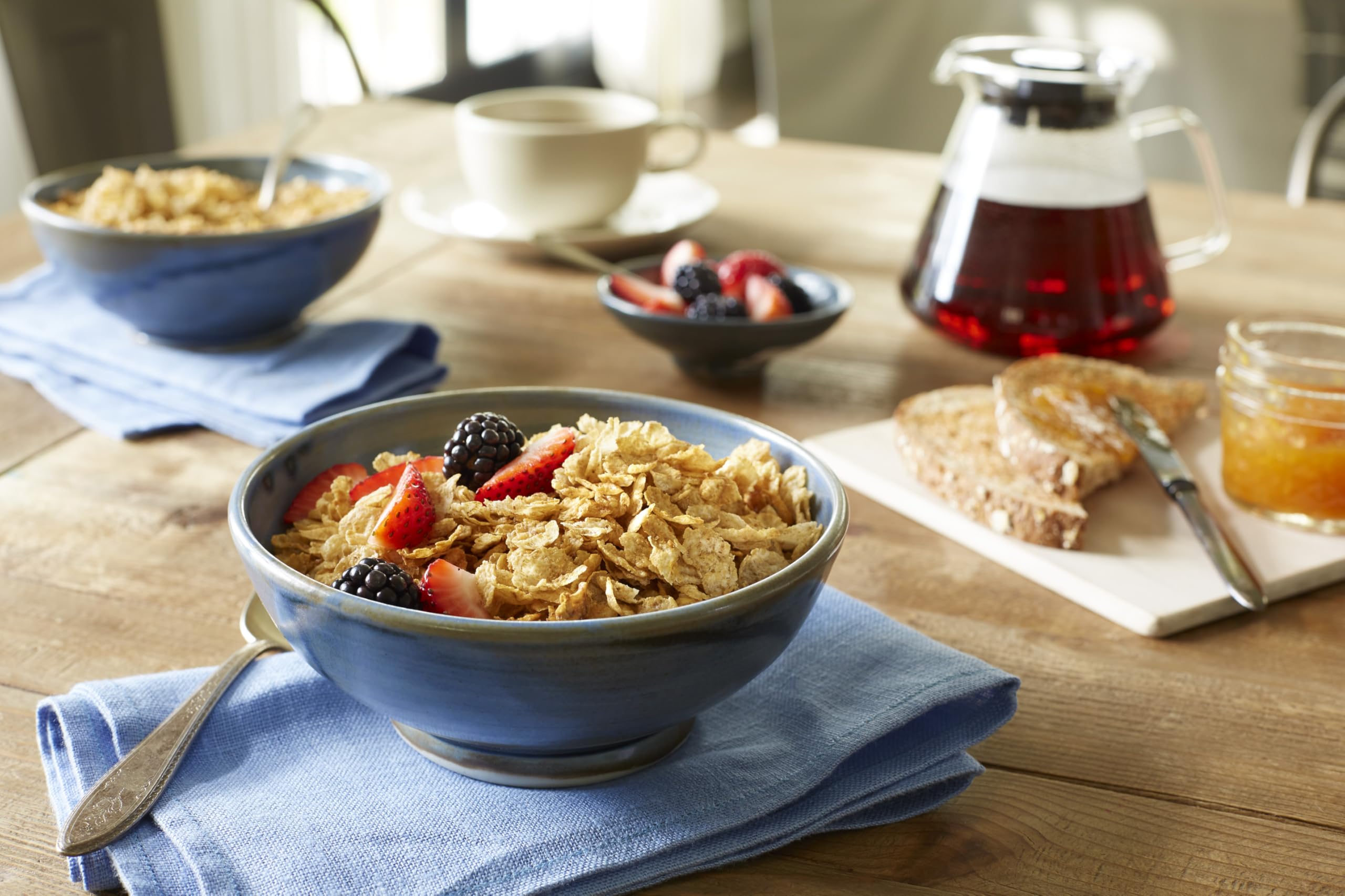 Grape-Nuts Flakes pouring into milk to illustrate quick morning meal.