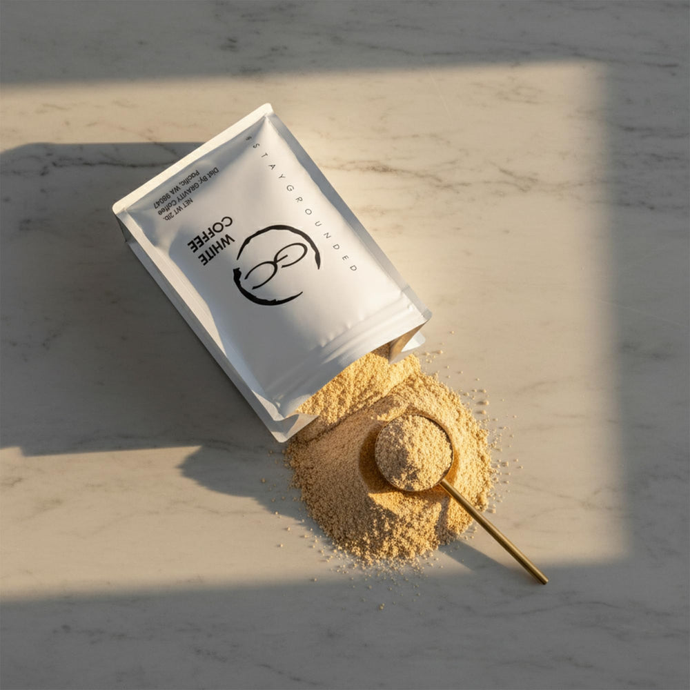 Gravity Coffee Signature White Coffee cup steaming with nutty earthy aroma.