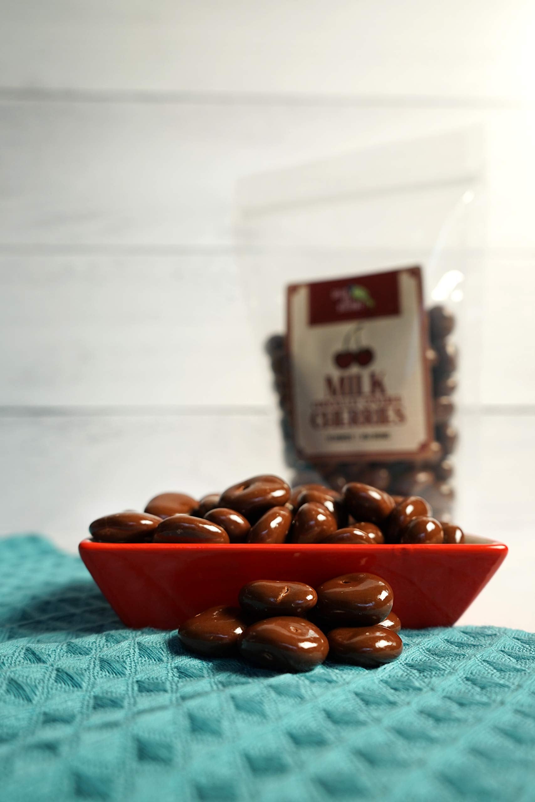 Green Jay Gourmet handmade chocolatiers coat each cherry for a smooth finish