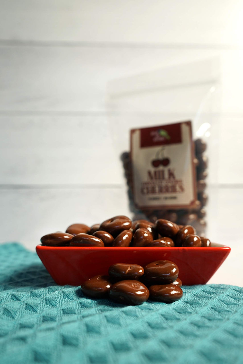 Green Jay Gourmet handmade chocolatiers coat each cherry for a smooth finish