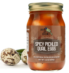 Green Jay Gourmet spicy pickled quail eggs in a jar, perfect for snacking