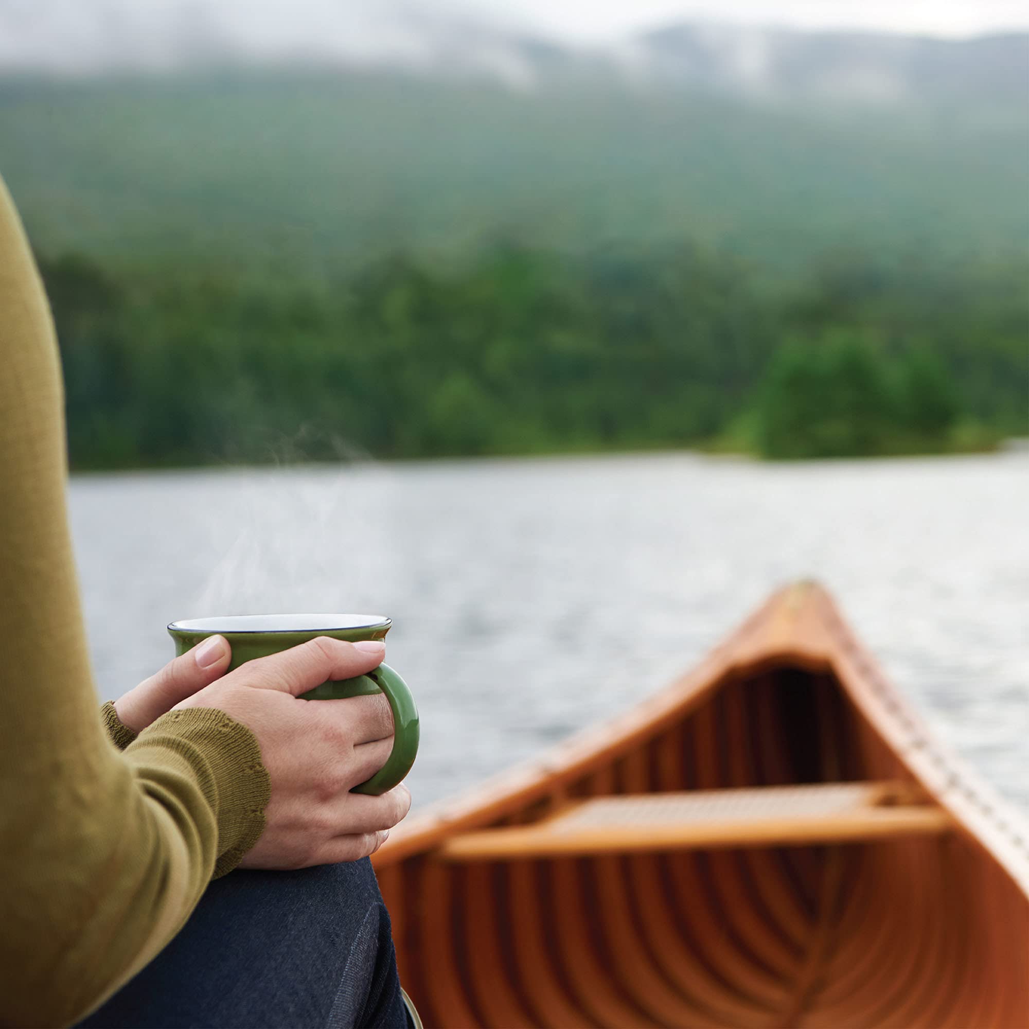 Outdoor coffee moment beside forest path suggests versatile outdoor brewing