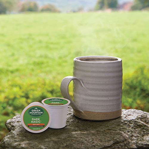 Green Mountain Dark Magic Decaf capsule beside a grinder