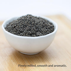 GREENMAX Black Sesame Powder dissolved in hot water forms a smooth, nutty beverage.