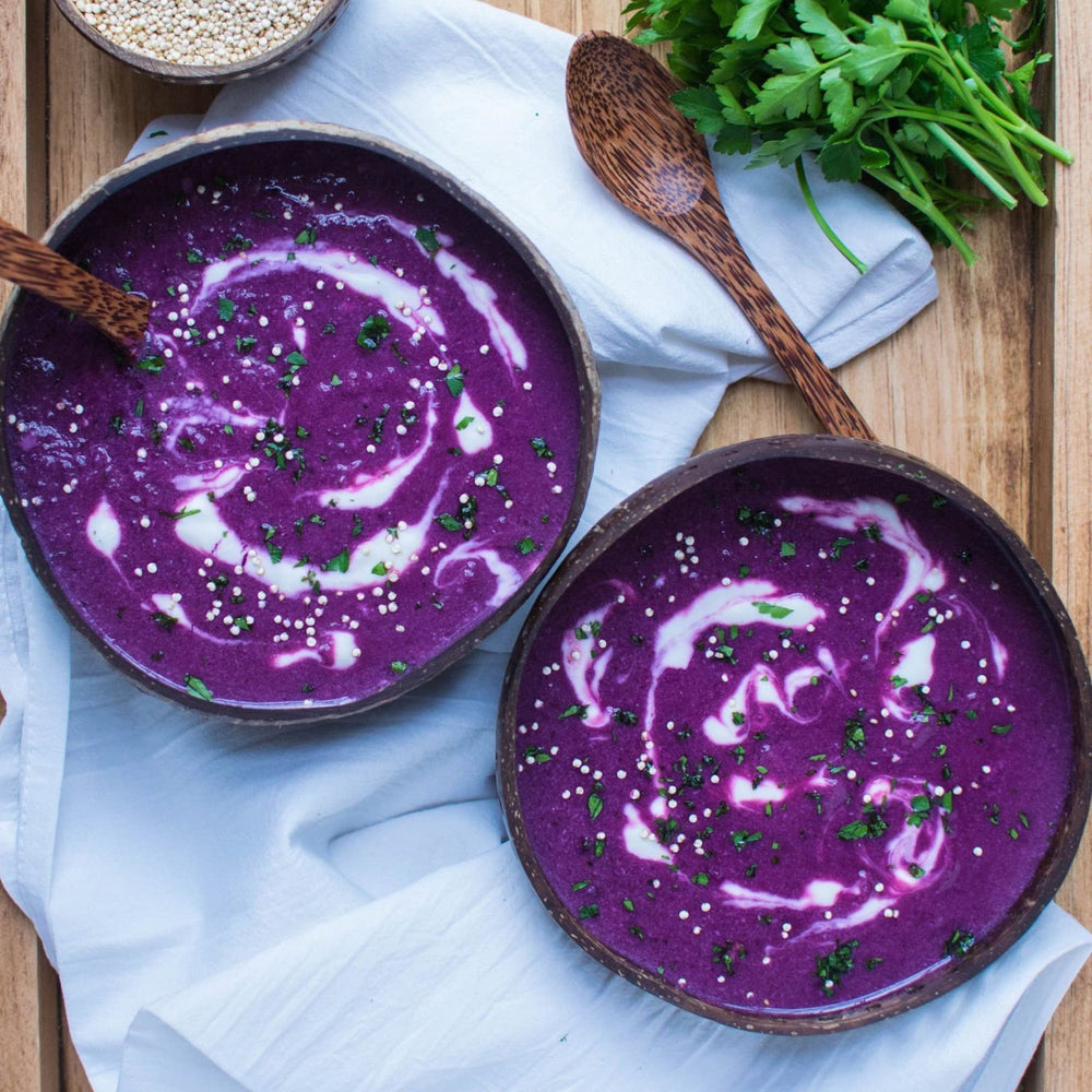 Grelim ube powder beside smoothie for a nutrient boost.