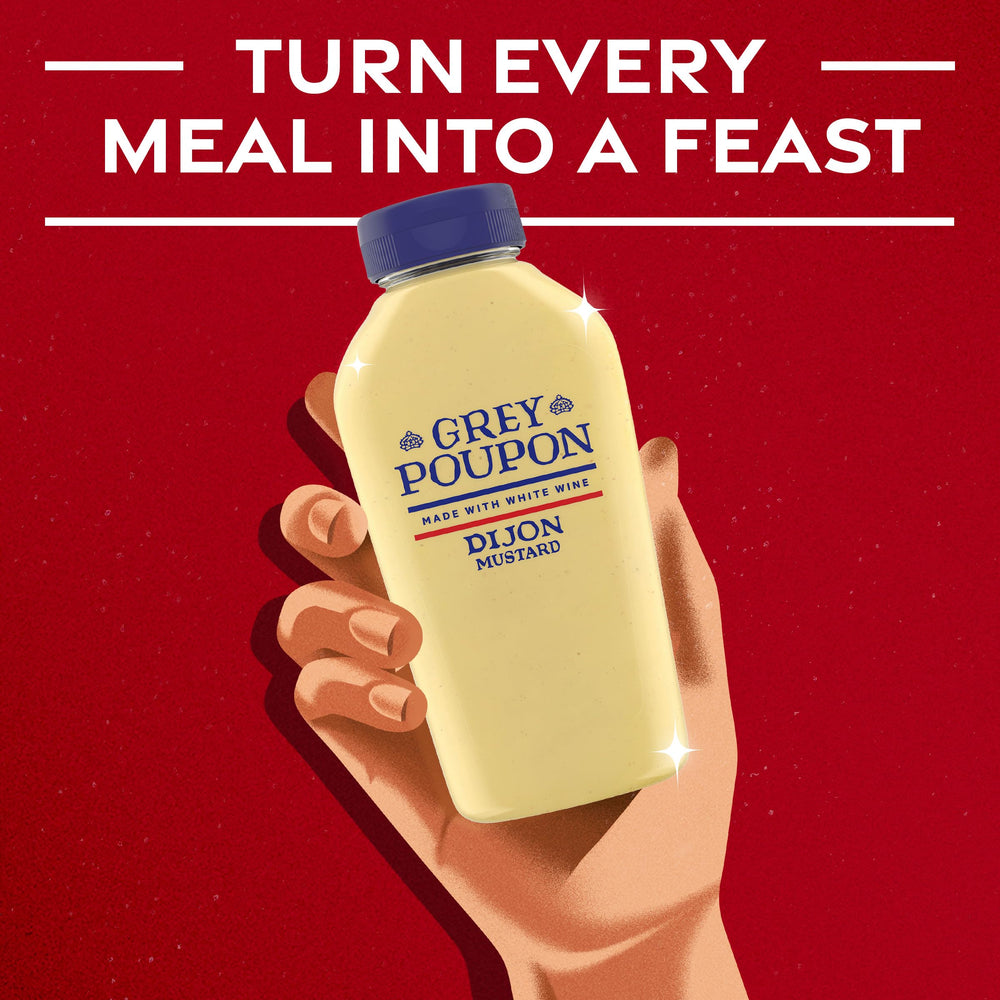 Grey Poupon Dijon mustard dressing ready to elevate salads.