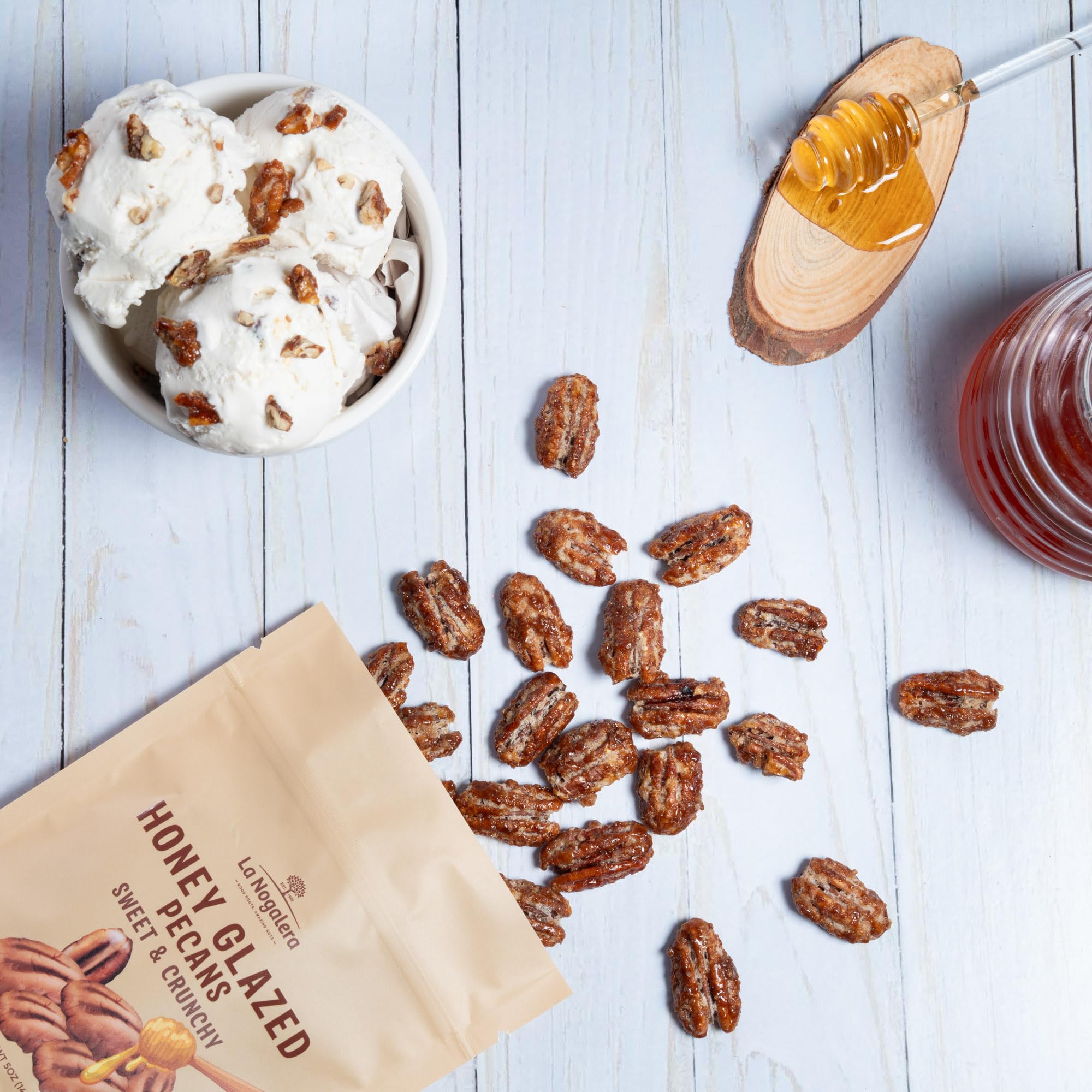 Grupo La Nogalera pecans on a cheese board for gourmet pairing.