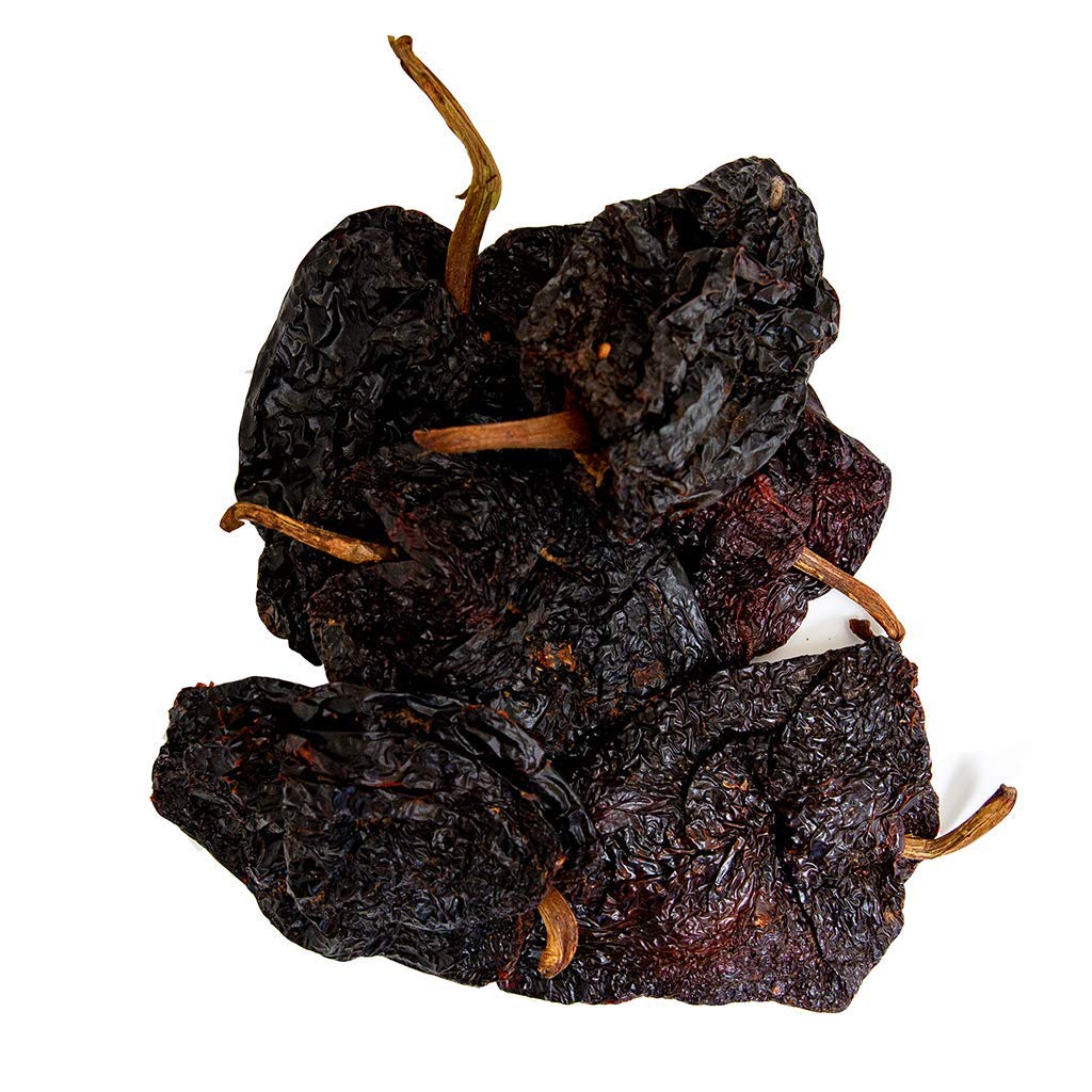 Guajillo chile close-up with glossy surface and berry notes