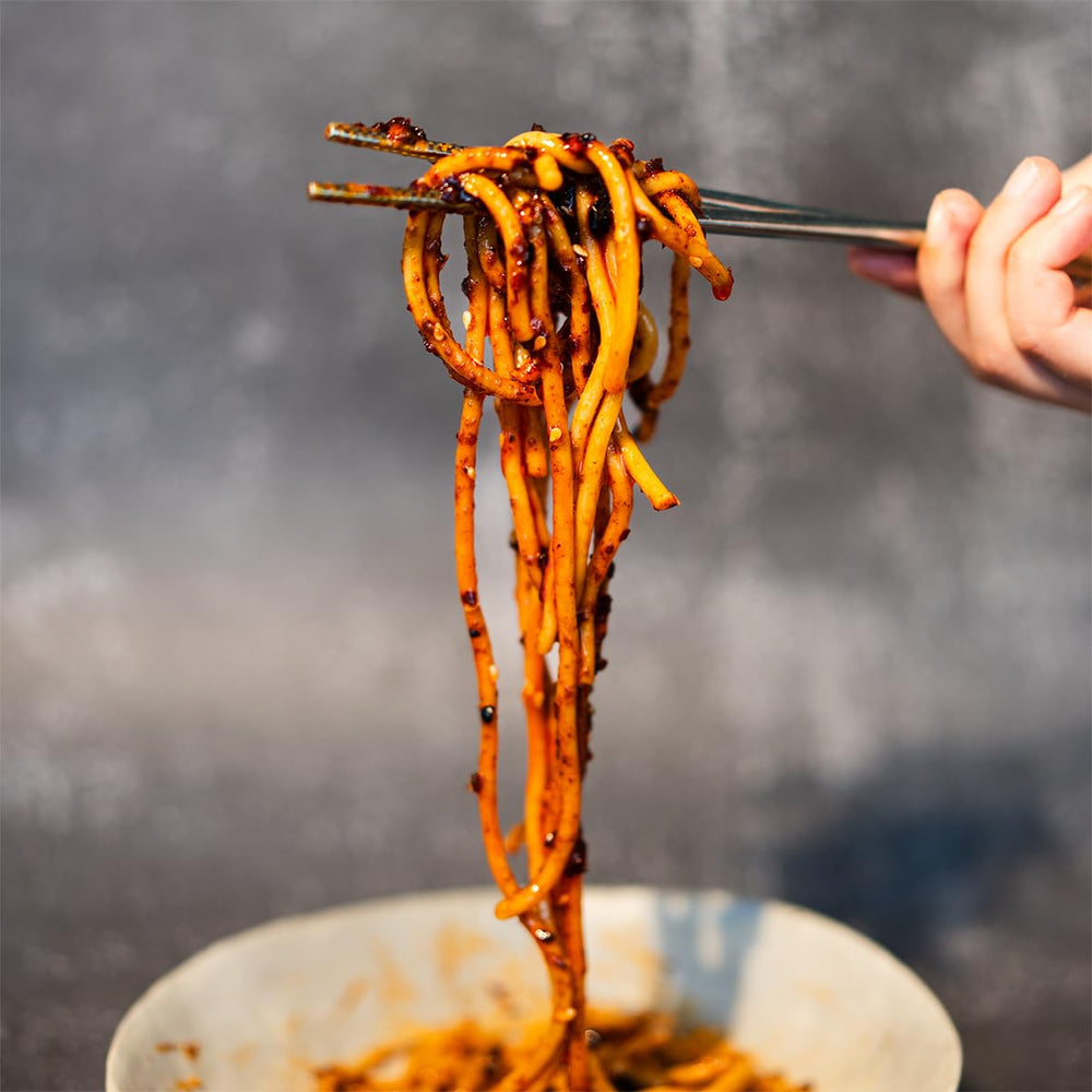 Stir-fry scene featuring GUIZ chili crisp for extra flavor