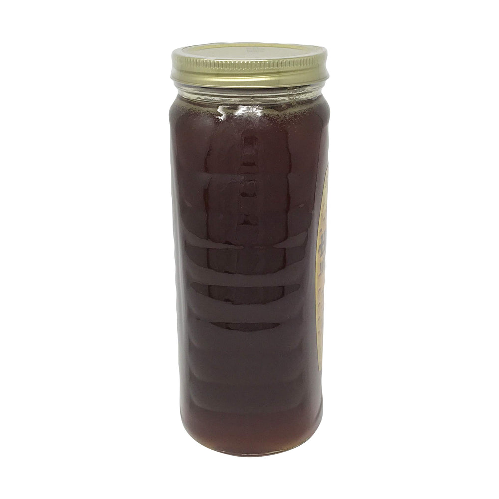 Gunter's Wildflower honey being poured, ideal drizzle on yogurt or toast.