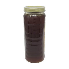 Gunter's Wildflower honey being poured, ideal drizzle on yogurt or toast.