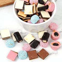 Assorted shapes and colors from Gustaf's Allsorts on a candy platter.