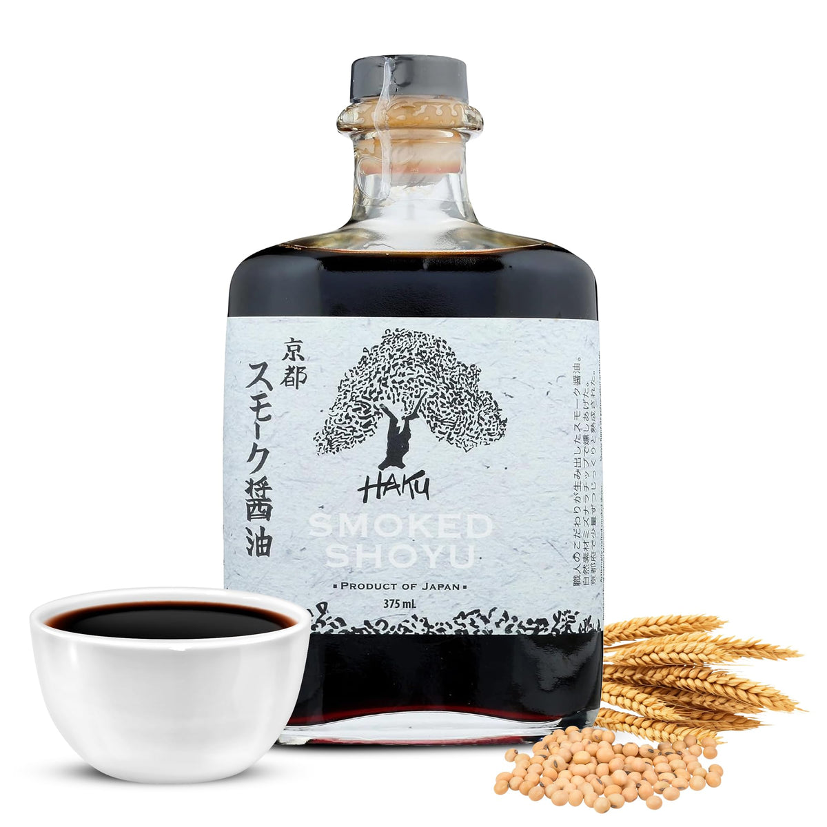 HAKU Smoked Shoyu bottle being poured, highlighting smoky aroma for sushi and sauces.