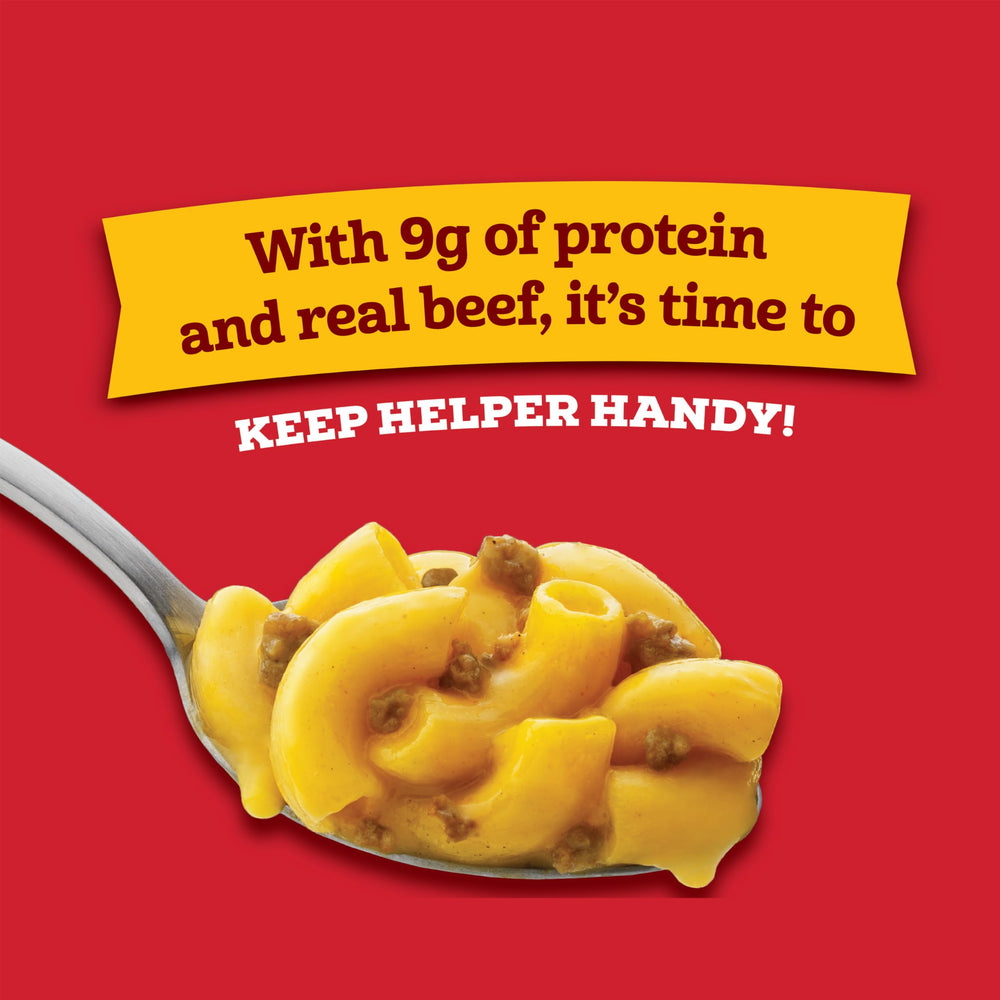 Hamburger Helper Cheeseburger Macaroni Cup stir-sauce shows blending sauce and pasta for a creamy finish.