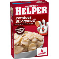 Hamburger Helper Potatoes Stroganoff browning beef in a skillet for a hearty base.