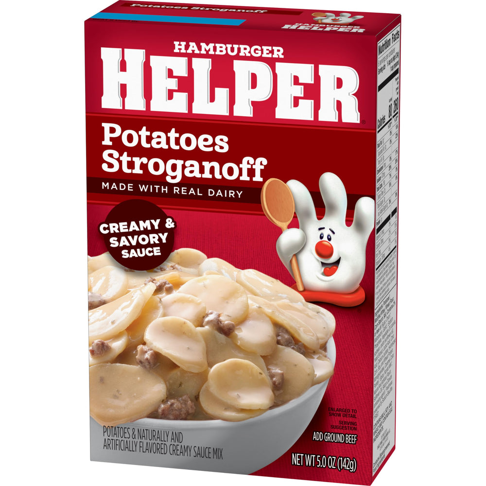 Hamburger Helper Potatoes Stroganoff simmering with creamy sauce and herbs.