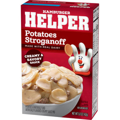 Hamburger Helper Potatoes Stroganoff simmering with creamy sauce and herbs.