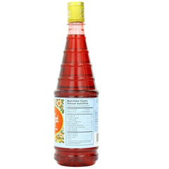 Hamdard Rooh Afza rose syrup mixed with water for a beverage.