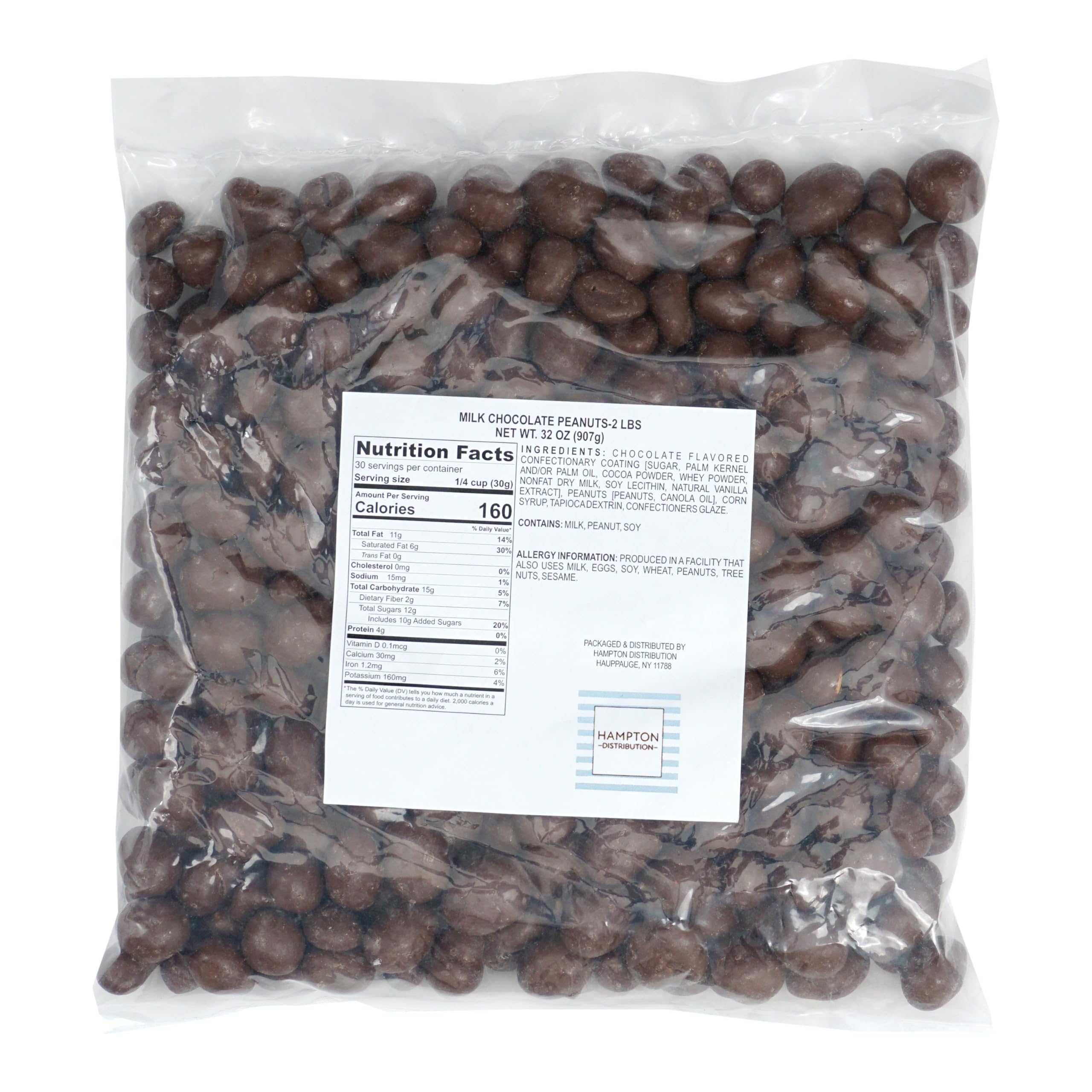 Close-up of The Hampton Candy Company milk chocolate-covered peanuts with a glossy shell for a delicious bite.