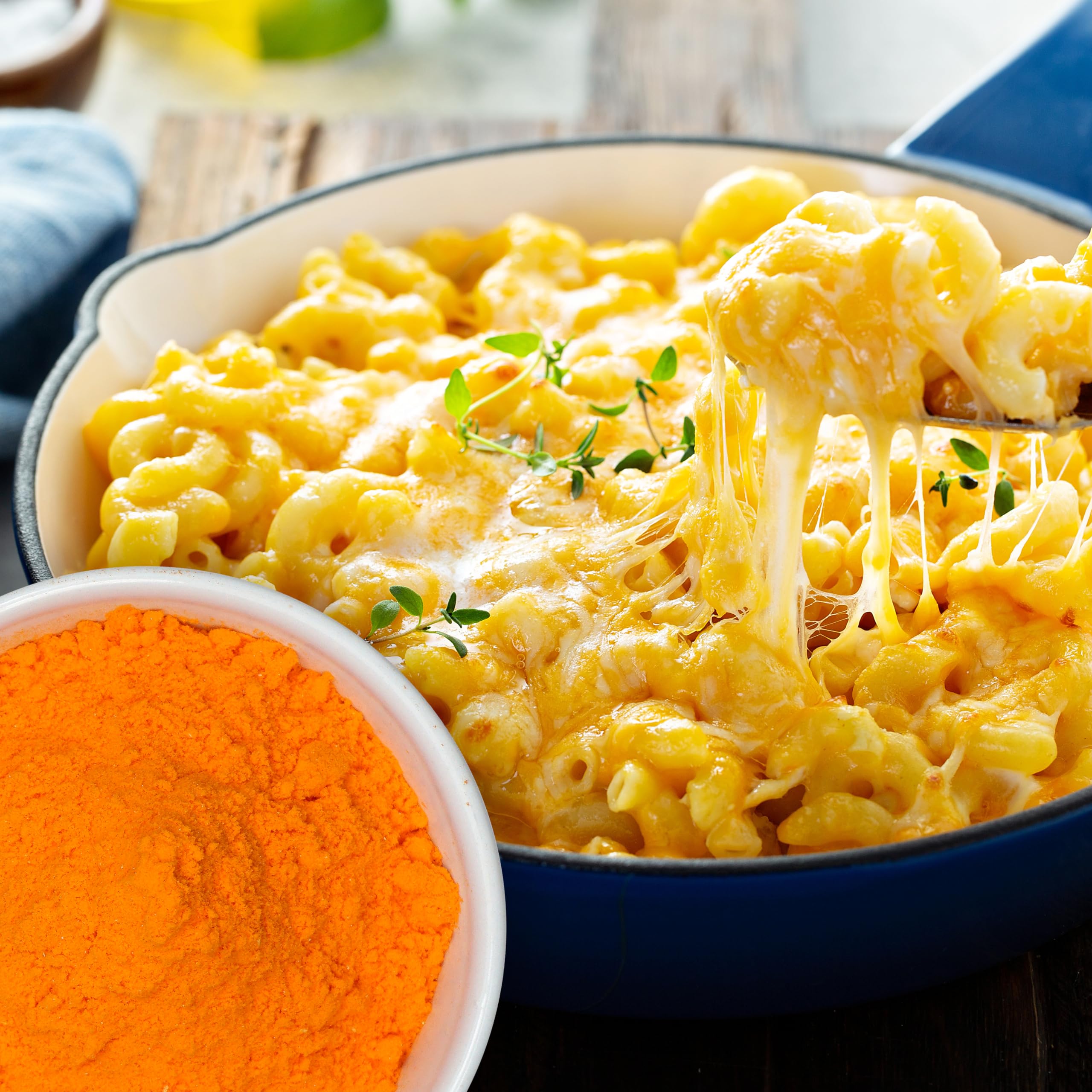 The Hampton Popcorn Company cheddar powder sprinkled on popcorn for savory lift
