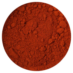 Hampton Distribution annatto powder jar close-up highlighting earthy, mild flavor for cooking.
