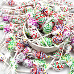 Charms Blow Pops Halloween candy display with colorful lollipops.