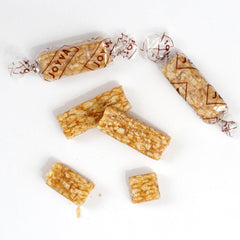 Close-up of sesame seeds on Hampton Sesame Crunch Bars highlighting nuttiness.