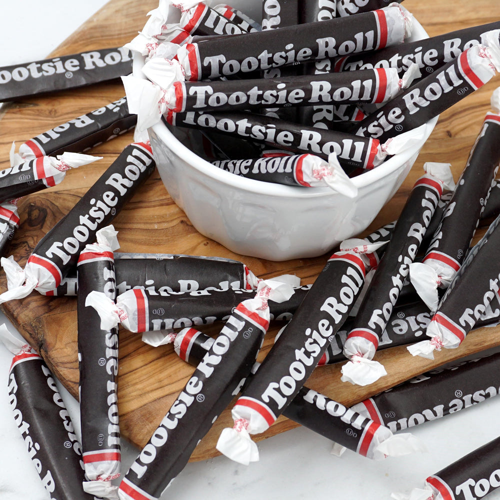 Individually wrapped Tootsie Rolls for quick party snacks.