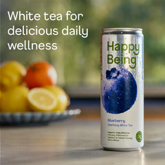 Happy Being Blueberry Sparkling White Tea label closeup highlighting turmeric and elderberry for wellness.