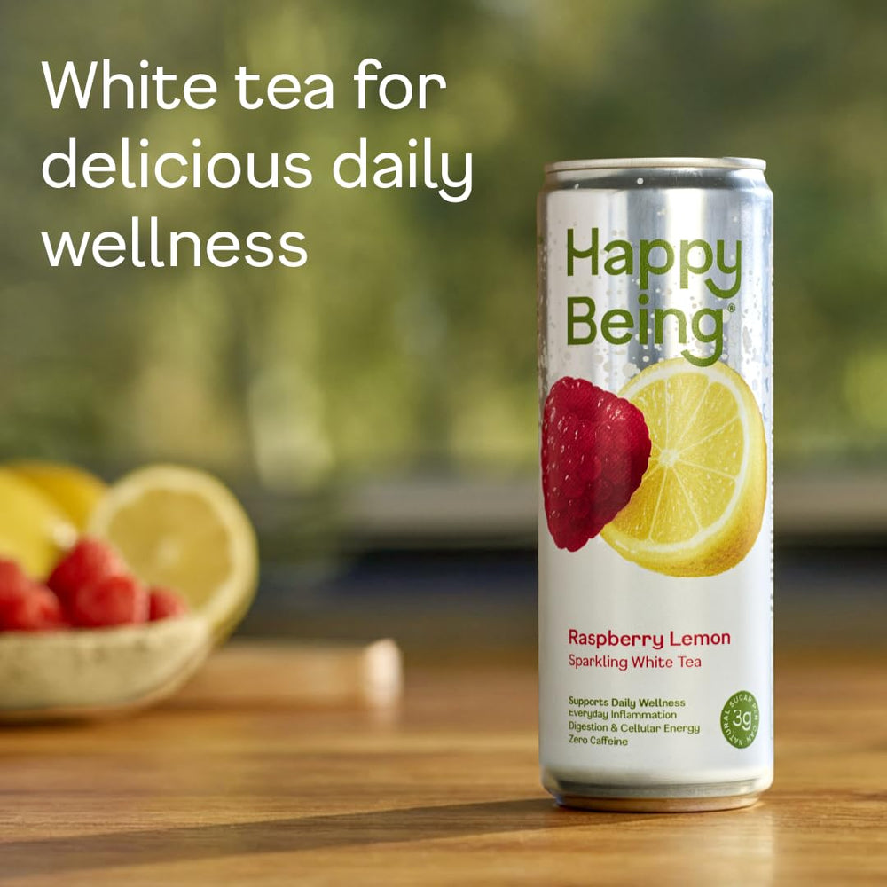 Happy Being Raspberry Lemonade Sparkling White Tea poured into a glass — bubbly and bright.