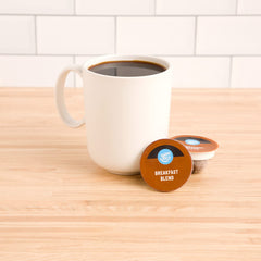 Happy Belly Breakfast Blend pods lined up for organized viewing on the shelf