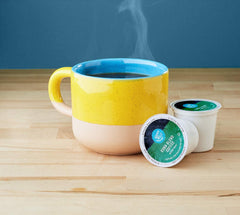 Happy Belly Kona Blend pods sourced from farms emphasizing quality.
