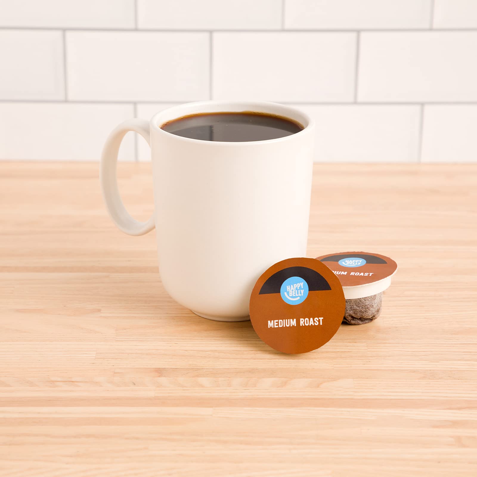 Close-up of a Happy Belly pod highlighting compact, easy-to-use design for quick brews.