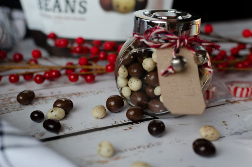 Close-up of Happy Bites coffee beans with glossy chocolate coating.