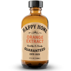 Happy Home Orange Extract bottle close-up showing vibrant citrus flavor for baking.