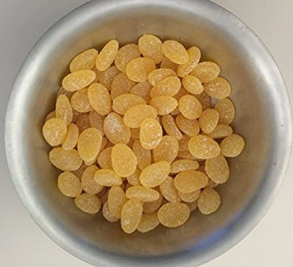 Haribo Ginger Lemon gummies closeup shows soft chew with bold zest.