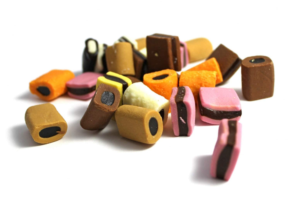 Haribo Konfekt Liquorice soft gummy candies in hand for a quick desk snack