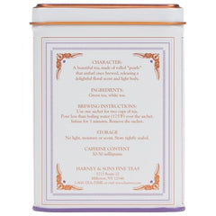 Dragon Pearl Jasmine tea sachet close-up releasing floral notes.