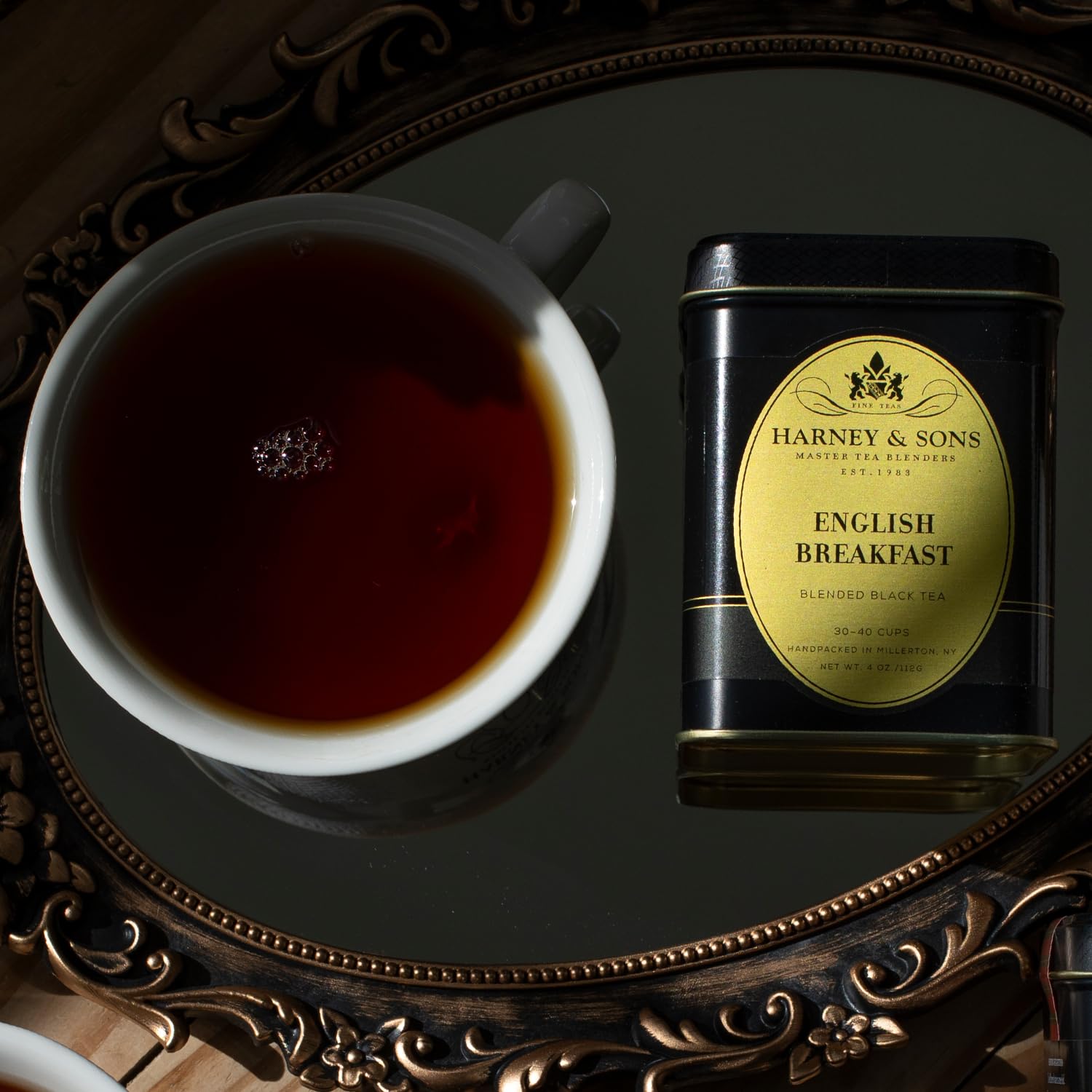 Open Harney & Sons English Breakfast tin showing premium Keemun leaves