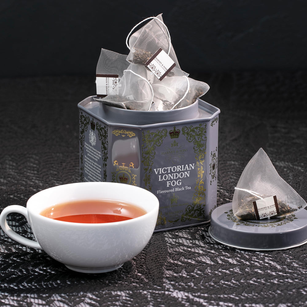 Tea being poured with steam, perfect for a cozy London moment.