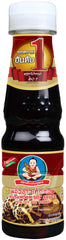 Healthy Boy Thai Mushroom Thin Soy Sauce bottle pouring to enhance stir-fries.