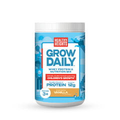 Healthy Heights Grow Daily vanilla canister on a kitchen counter showing kid-friendly protein.