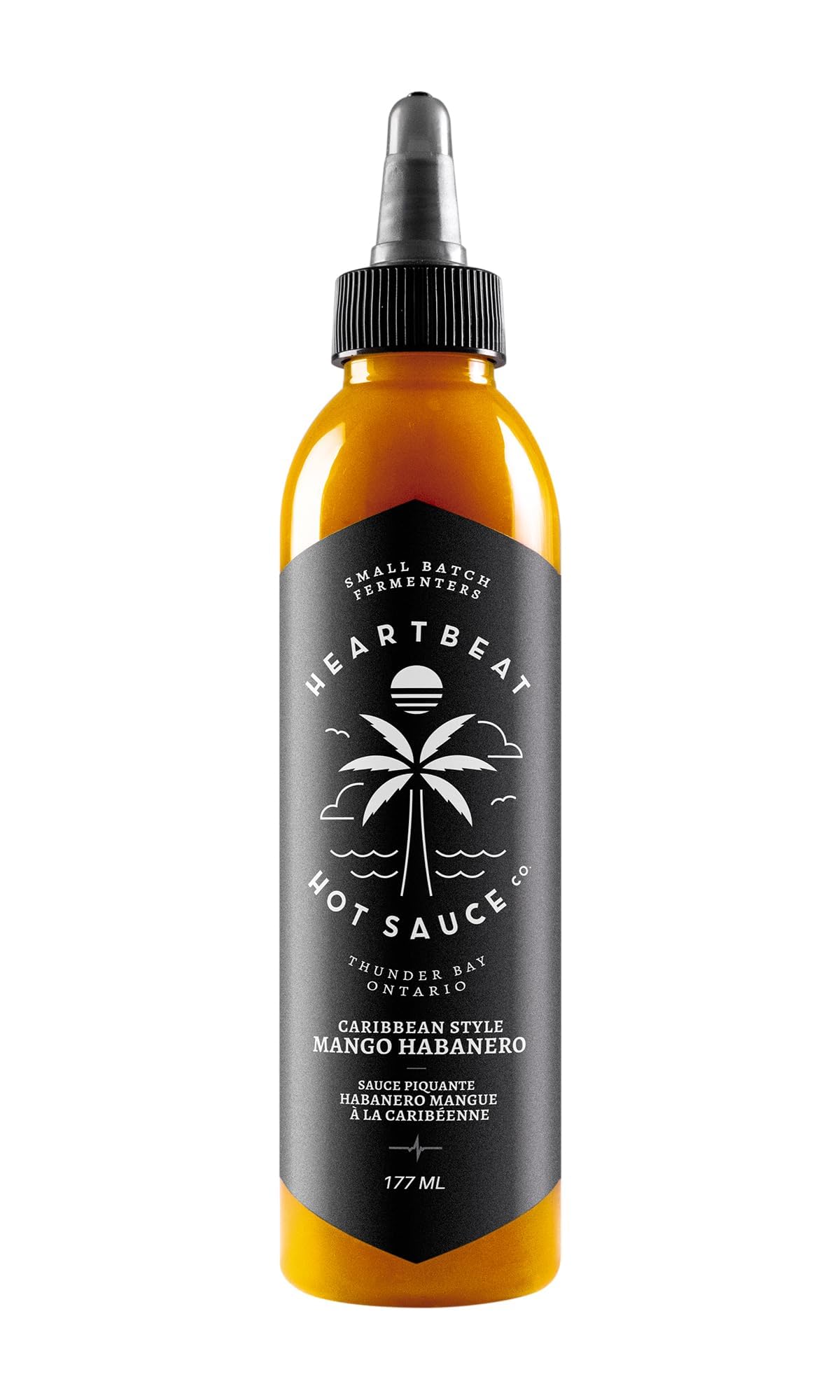 Heartbeat Hot Sauce Co. Mango Habanero bottle on table with balanced heat.