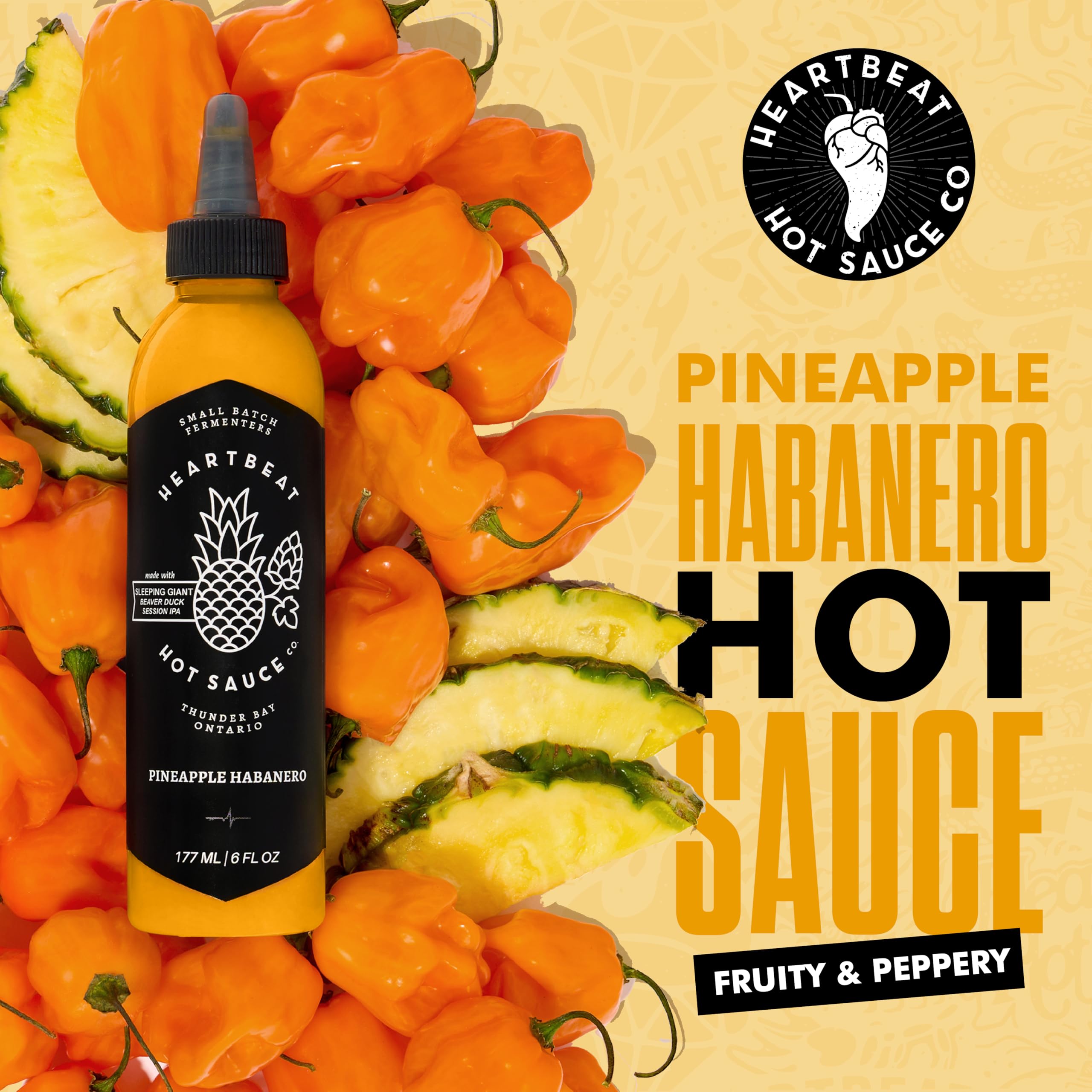 Heartbeat Hot Sauce Co. Pineapple Habanero label highlights bold, vegan, all-natural flavor.