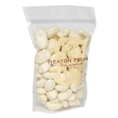 Heaton Pecans white chocolate halves in a clear bag, ideal for gifting and sharing.
