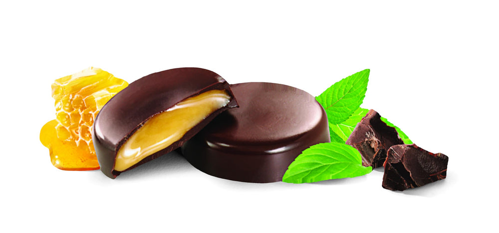 Close-up of Heavenly Organics Mint Chocolate Honey Patties bite with smooth honey center.